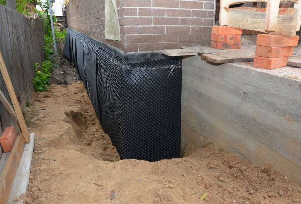 Happy homeowners after waterproofing job in Riddleton